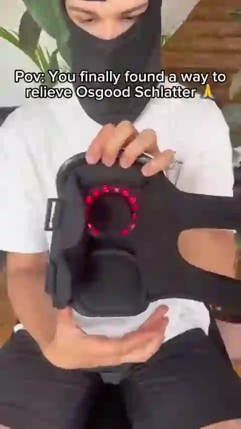A GlowKnee owner showing the inside of the massager and its red light ring